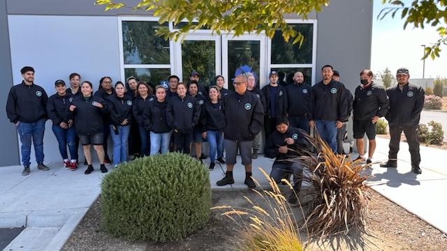a group of people standing in front of a building
