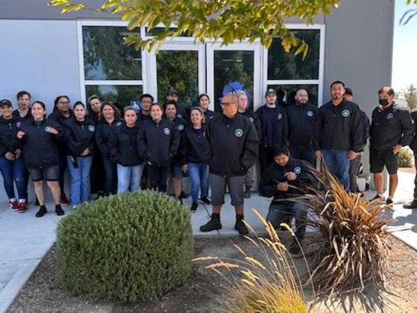 a group of people standing in front of a building