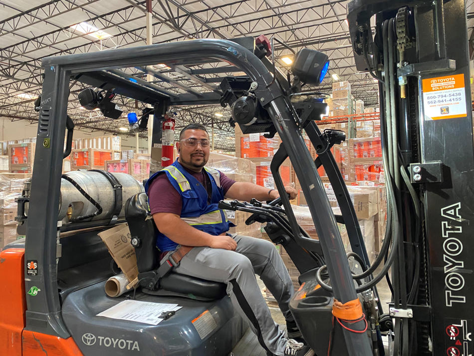 a man sitting in a forklift