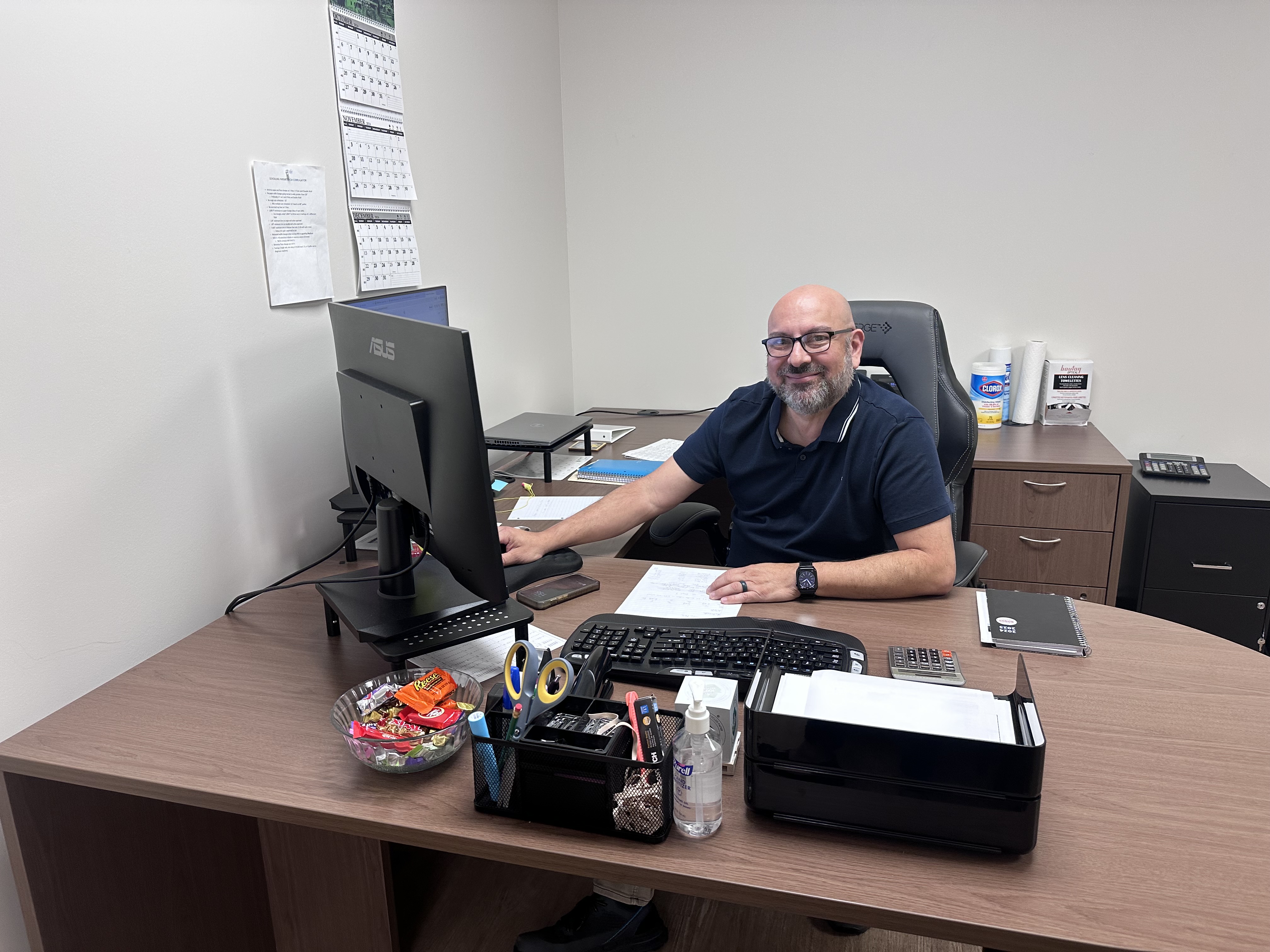 a man sitting at a desk with a computer