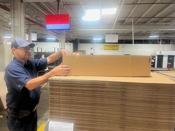 a man holding a large box