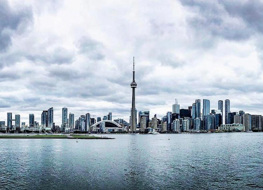 a city skyline with a body of water