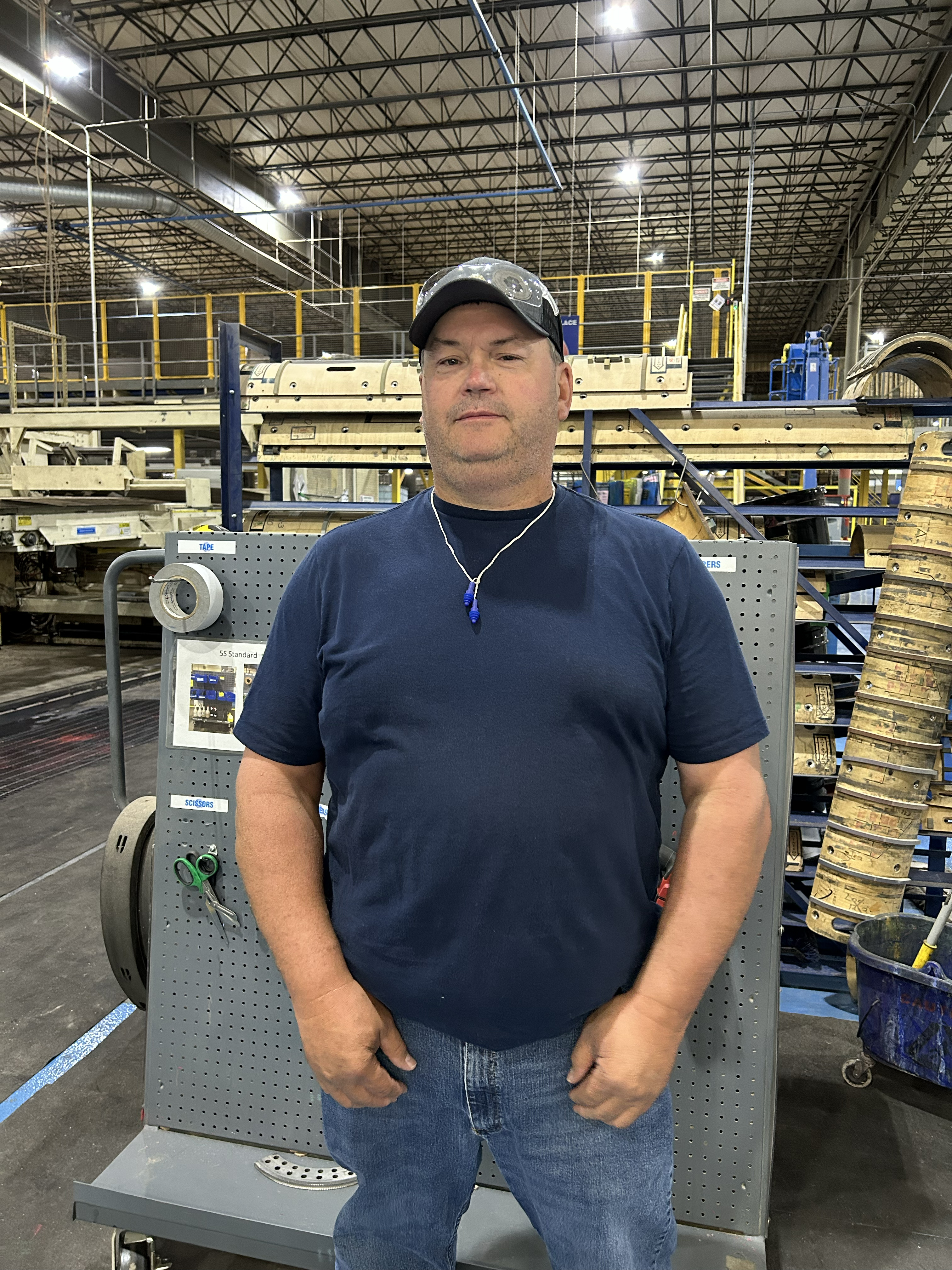 a man standing in a factory