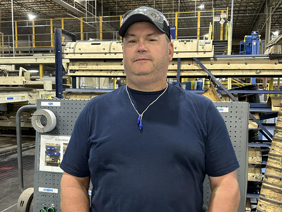a man standing in a factory