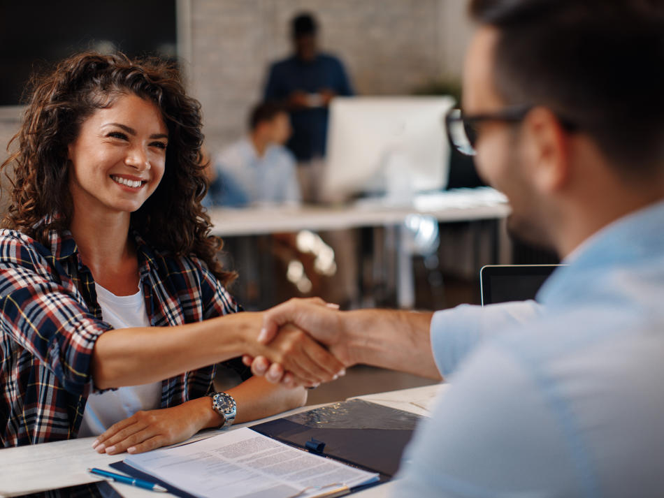 a man and woman shaking hands