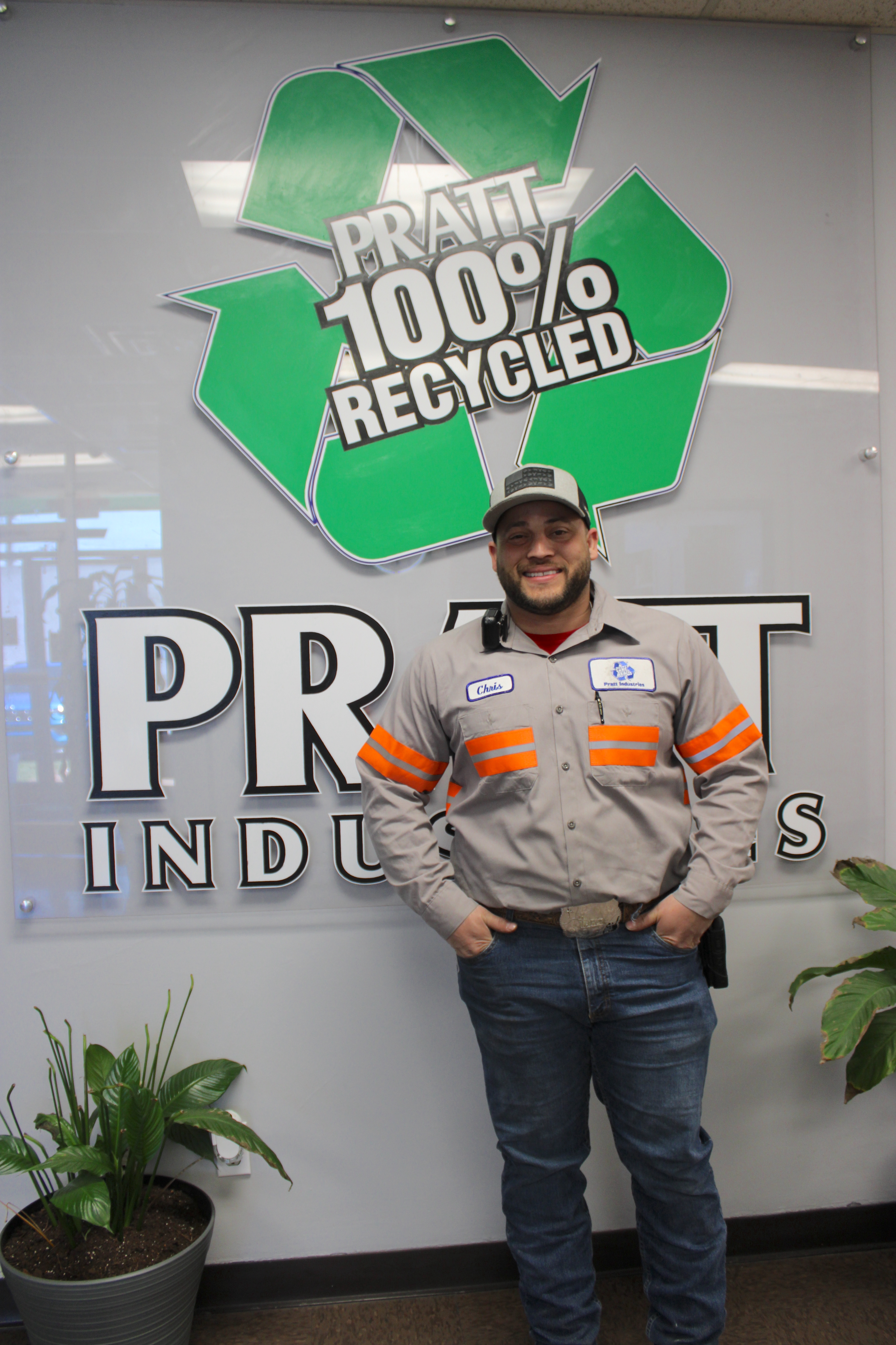 a man standing in front of a sign